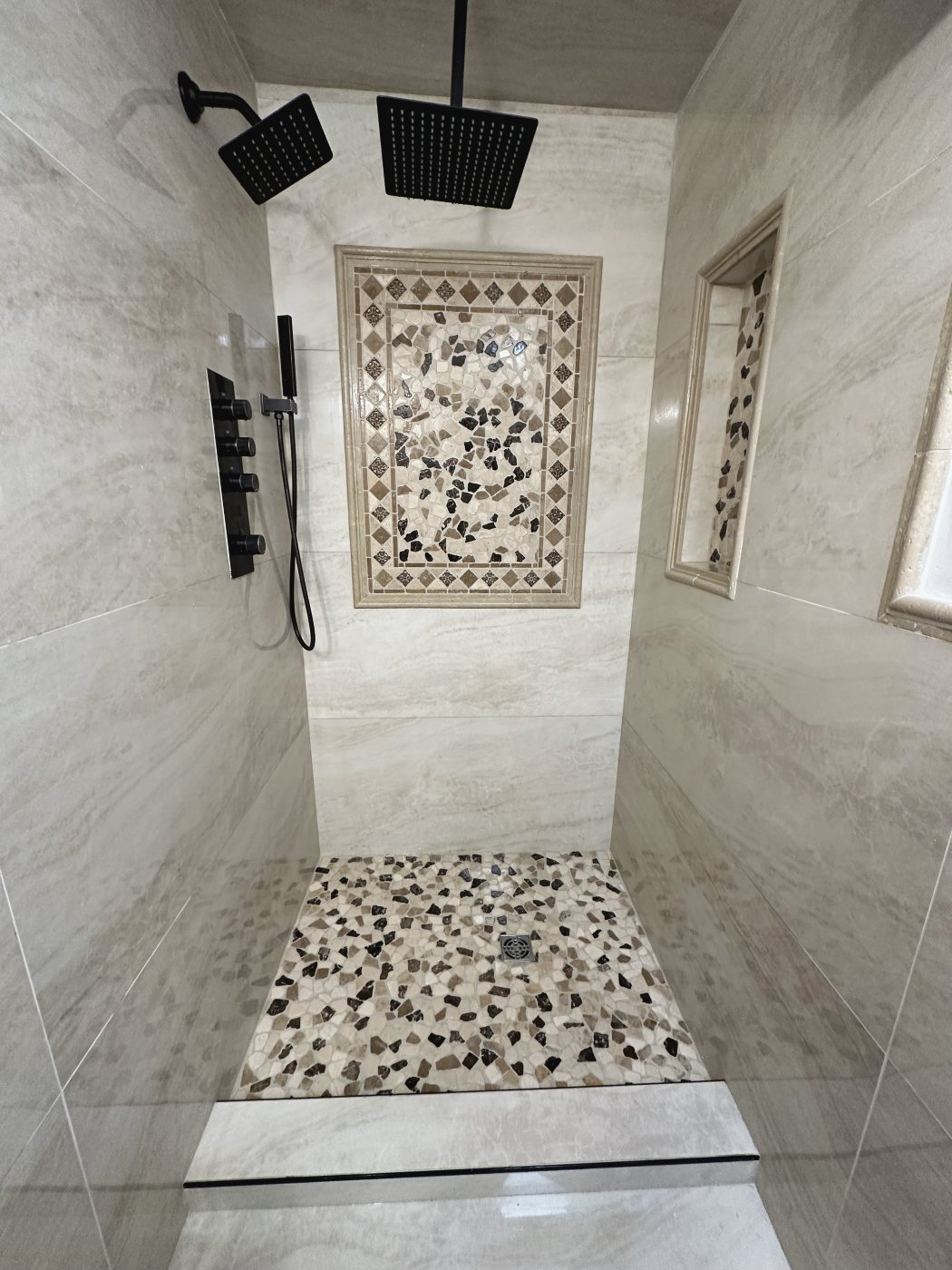 Shower with stone mosaic inlay